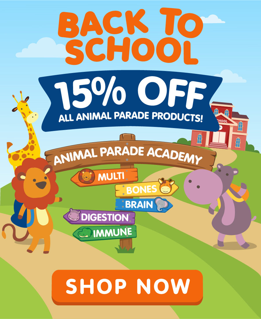 Animal Parade back-to-school promotional banner featuring cartoon jungle animals, a school scene, and Animal Parade Academy signposts highlighting Multivitamin, Bones, Brain, Digestion, and Immune support, with a “15% Off All Animal Parade Products” offer and a “Shop Now” button.