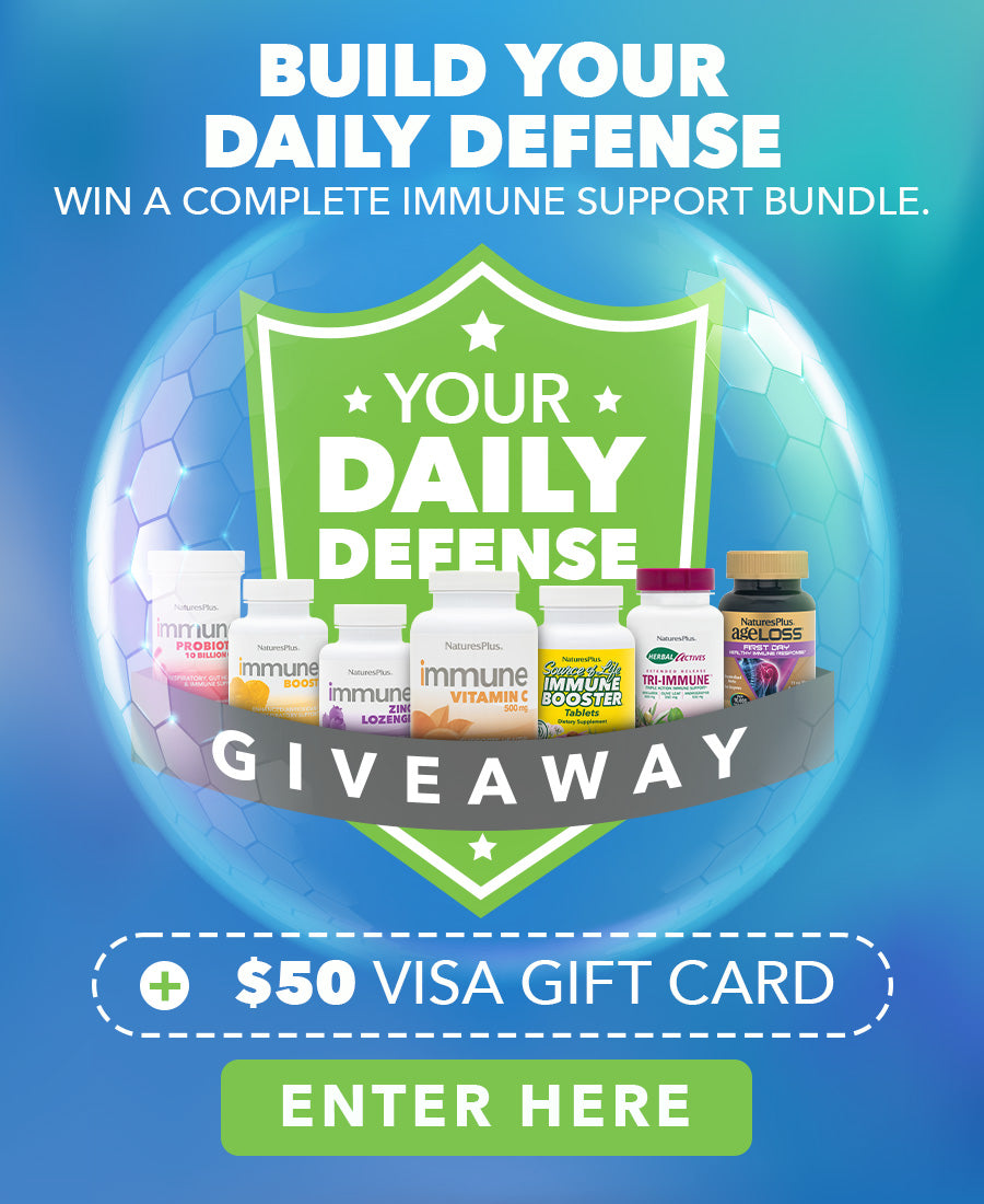 Blue giveaway banner promoting the “Build Your Daily Defense” campaign, featuring an immune support product bundle, a green shield graphic, and a $50 Visa gift card prize.